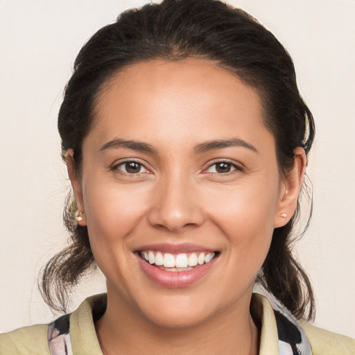 Joyful white young-adult female with medium  brown hair and brown eyes