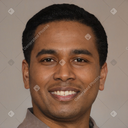 Joyful latino young-adult male with short  black hair and brown eyes