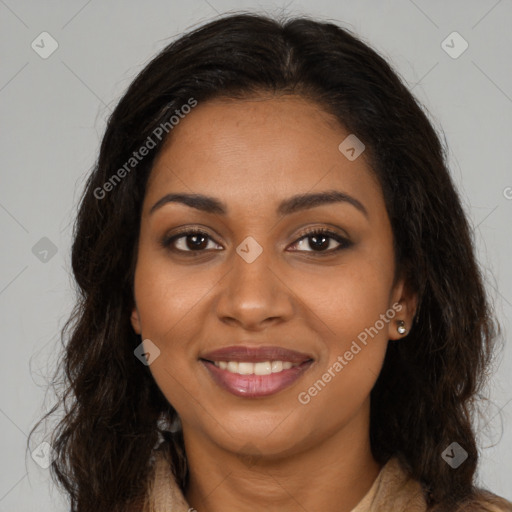 Joyful black young-adult female with long  brown hair and brown eyes