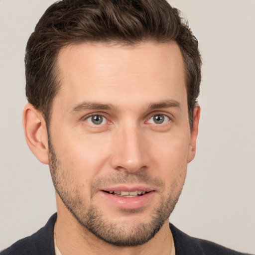 Joyful white young-adult male with short  brown hair and brown eyes