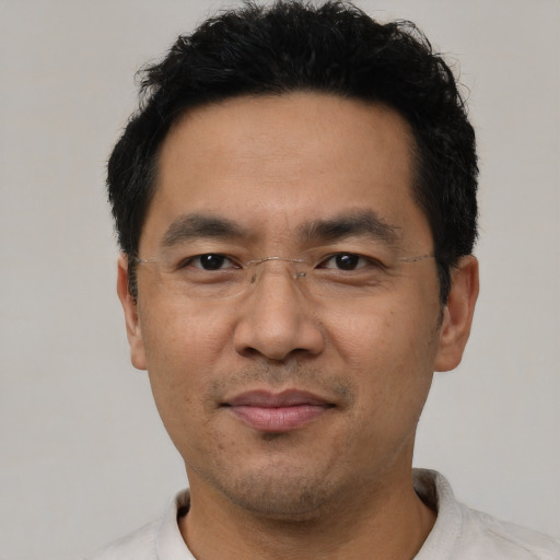 Neutral asian adult male with short  black hair and brown eyes