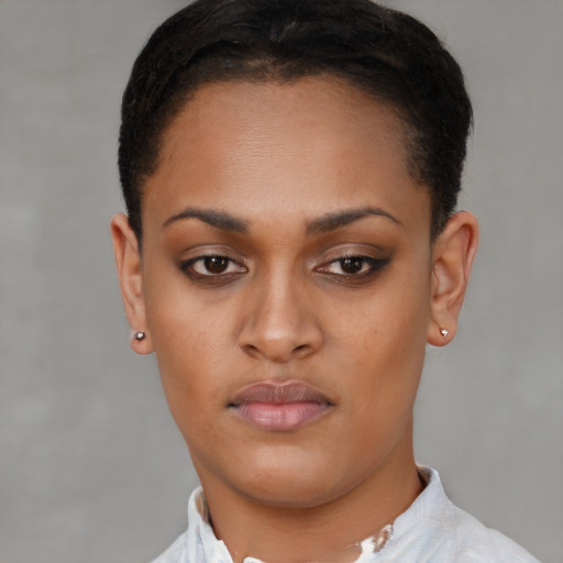 Neutral latino young-adult female with short  brown hair and brown eyes
