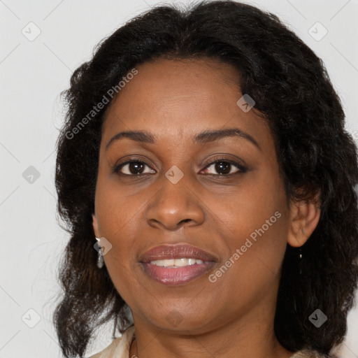 Joyful black adult female with medium  brown hair and brown eyes