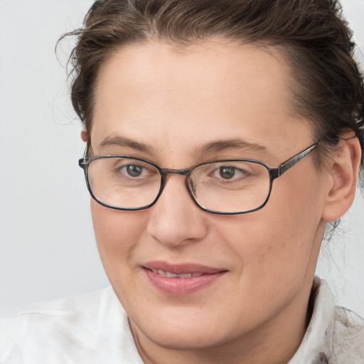 Joyful white adult female with short  brown hair and brown eyes