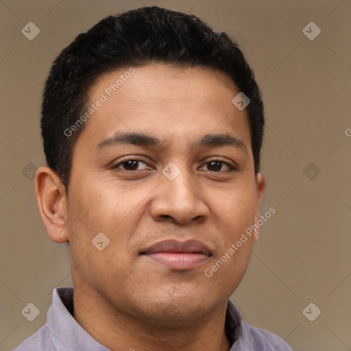 Joyful latino young-adult male with short  brown hair and brown eyes