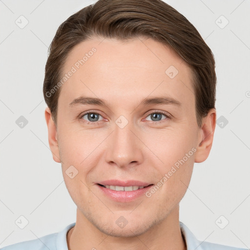 Joyful white young-adult male with short  brown hair and grey eyes