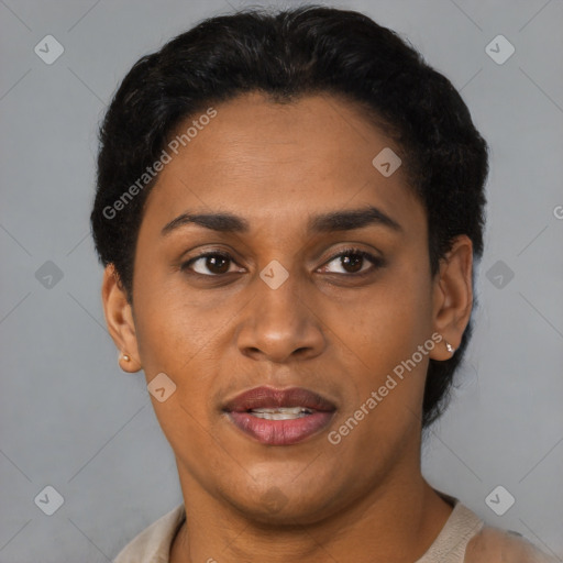 Joyful black young-adult female with short  black hair and brown eyes