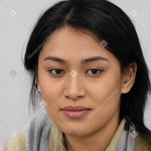 Joyful latino young-adult female with long  brown hair and brown eyes