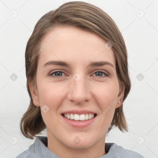 Joyful white young-adult female with medium  brown hair and grey eyes