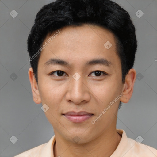 Joyful asian young-adult male with short  black hair and brown eyes