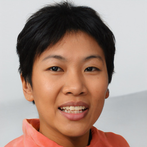 Joyful asian young-adult female with short  brown hair and brown eyes