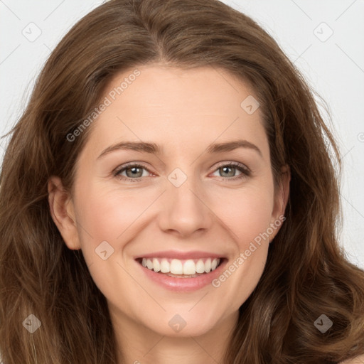 Joyful white young-adult female with long  brown hair and green eyes