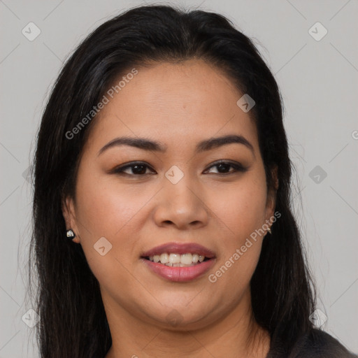 Joyful latino young-adult female with long  brown hair and brown eyes