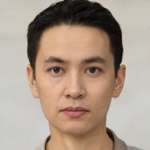 Neutral white young-adult male with short  black hair and brown eyes
