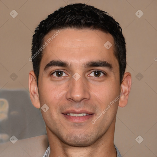 Joyful white young-adult male with short  black hair and brown eyes