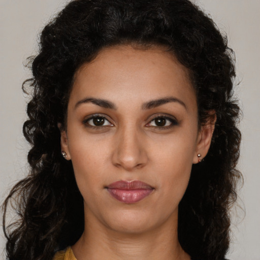 Neutral latino young-adult female with long  brown hair and brown eyes