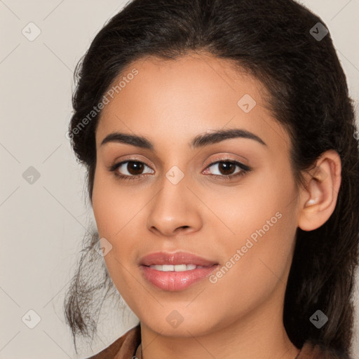 Joyful latino young-adult female with long  brown hair and brown eyes