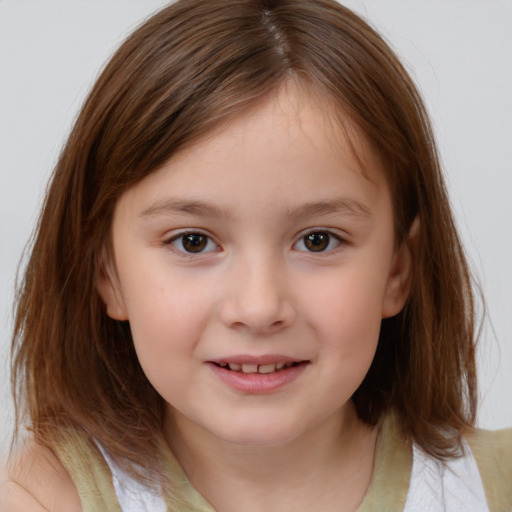 Joyful white child female with medium  brown hair and brown eyes