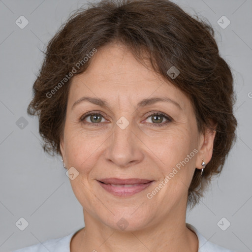 Joyful white adult female with short  brown hair and brown eyes