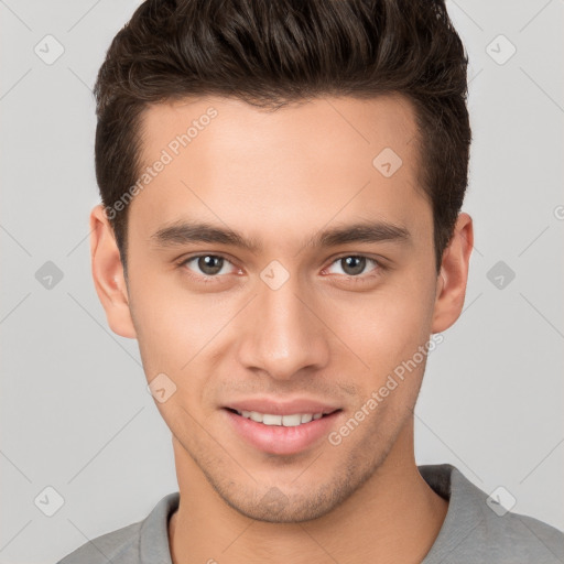 Joyful white young-adult male with short  brown hair and brown eyes