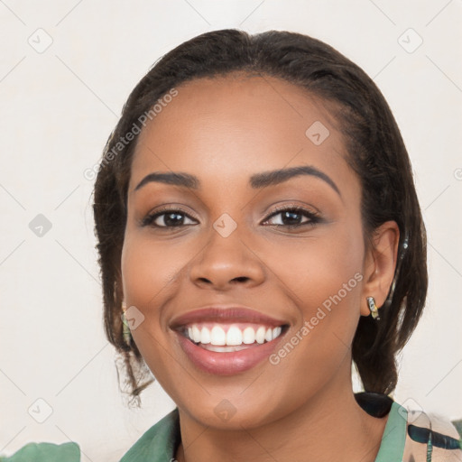 Joyful latino young-adult female with medium  black hair and brown eyes