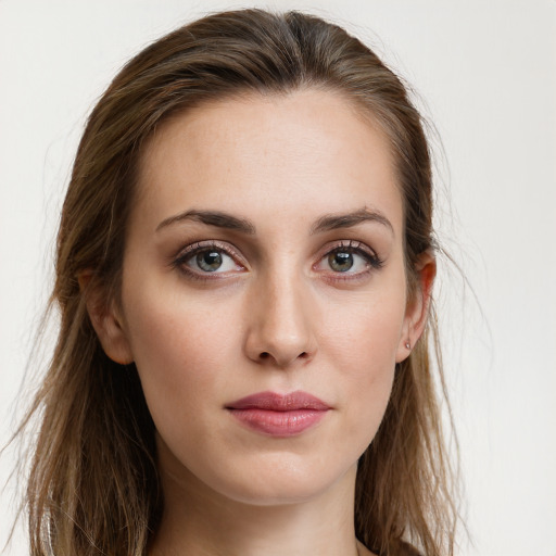 Joyful white young-adult female with long  brown hair and blue eyes