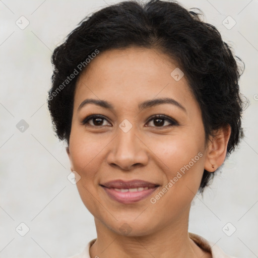 Joyful latino adult female with medium  brown hair and brown eyes