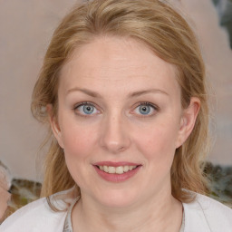 Joyful white young-adult female with medium  brown hair and blue eyes