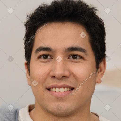 Joyful latino young-adult male with short  brown hair and brown eyes