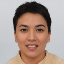 Joyful asian young-adult female with short  brown hair and brown eyes