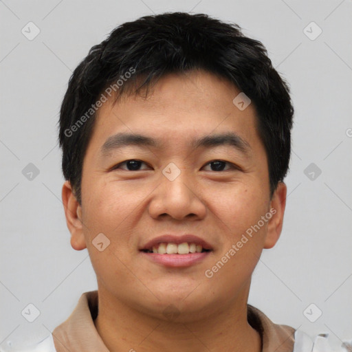 Joyful asian young-adult male with short  black hair and brown eyes