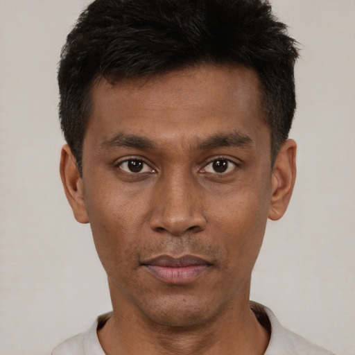 Neutral black young-adult male with short  black hair and brown eyes