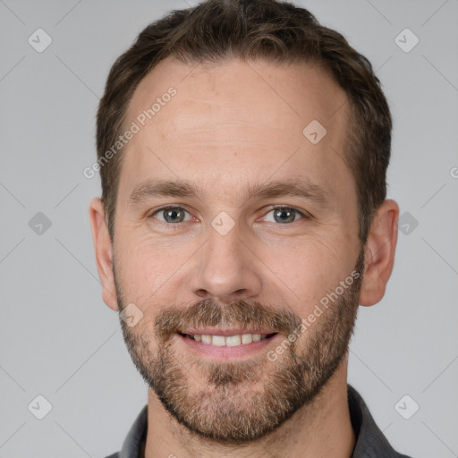 Joyful white adult male with short  brown hair and grey eyes