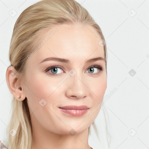 Joyful white young-adult female with long  brown hair and blue eyes