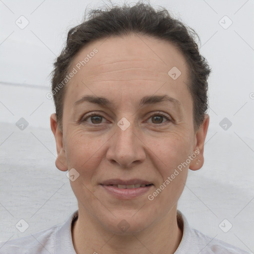 Joyful white adult female with short  brown hair and brown eyes