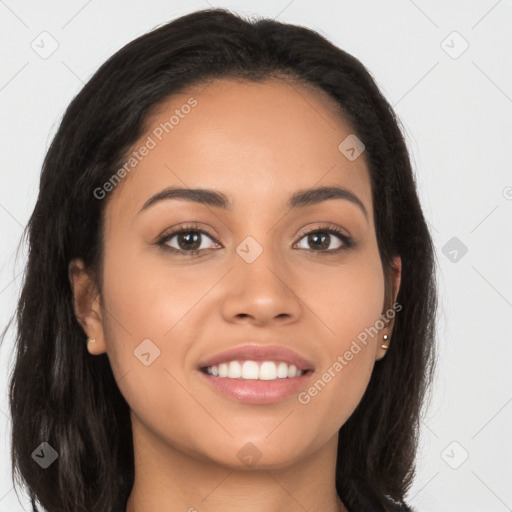 Joyful latino young-adult female with long  brown hair and brown eyes