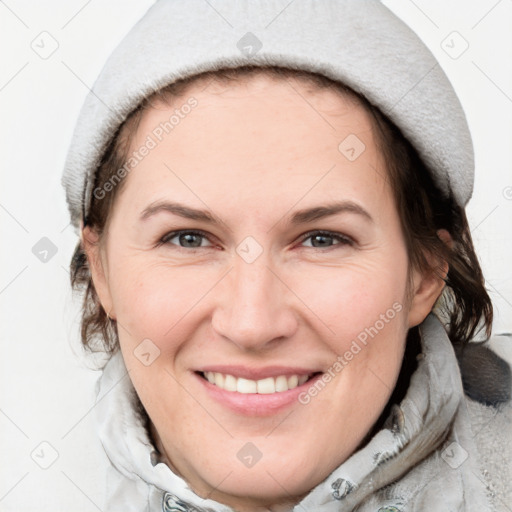 Joyful white adult female with medium  brown hair and grey eyes