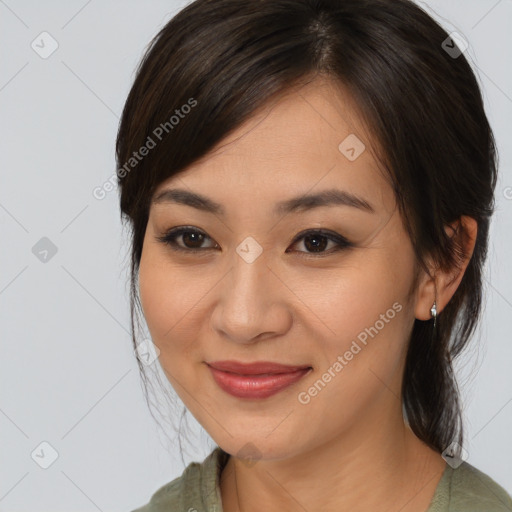 Joyful asian young-adult female with medium  brown hair and brown eyes