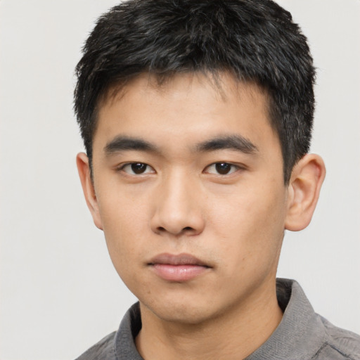 Neutral asian young-adult male with short  black hair and brown eyes