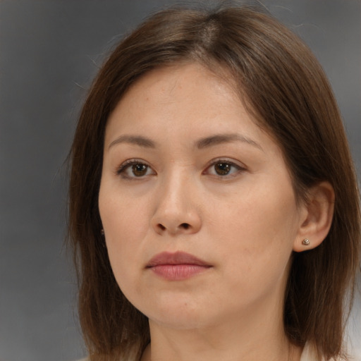 Neutral white young-adult female with medium  brown hair and brown eyes