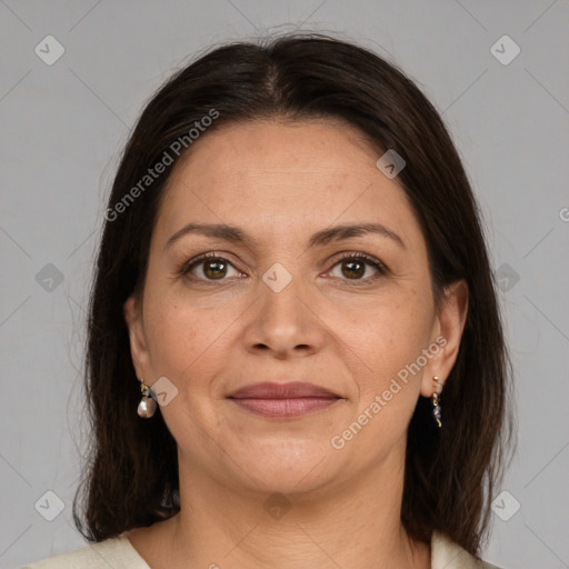 Joyful white adult female with medium  brown hair and brown eyes