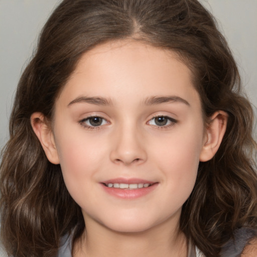 Joyful white child female with medium  brown hair and brown eyes