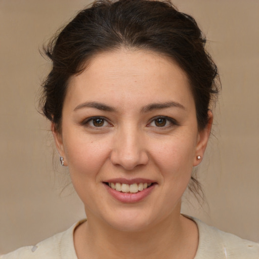 Joyful white young-adult female with medium  brown hair and brown eyes