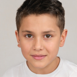 Joyful white child male with short  brown hair and brown eyes