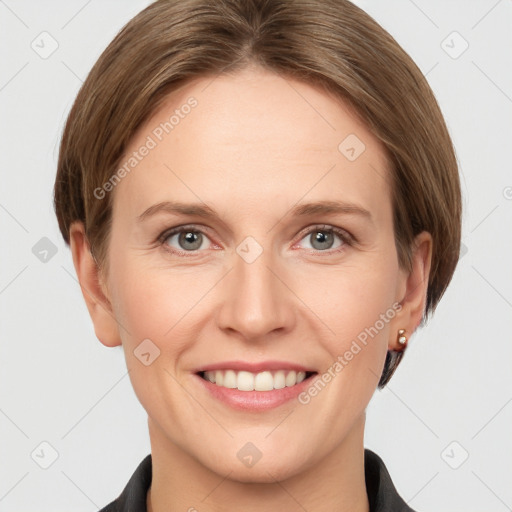 Joyful white young-adult female with short  brown hair and grey eyes