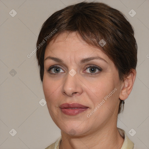 Joyful white adult female with medium  brown hair and brown eyes