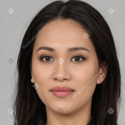 Joyful latino young-adult female with long  brown hair and brown eyes