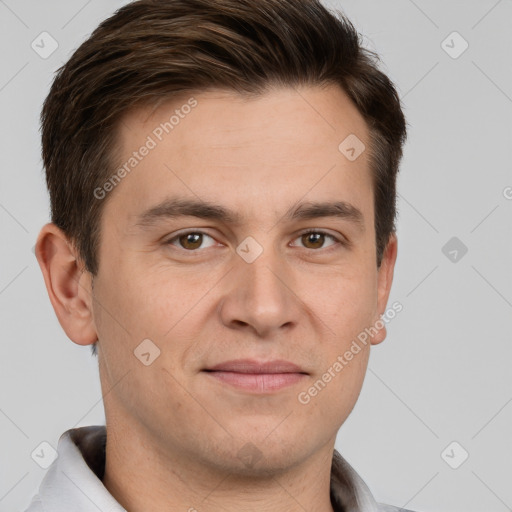 Joyful white adult male with short  brown hair and brown eyes