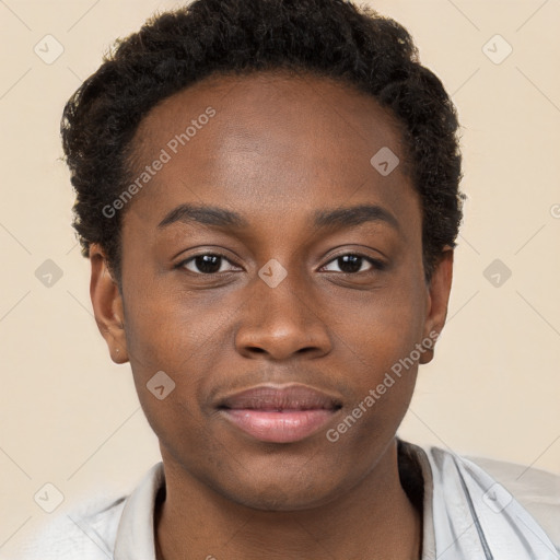 Joyful black young-adult male with short  brown hair and brown eyes