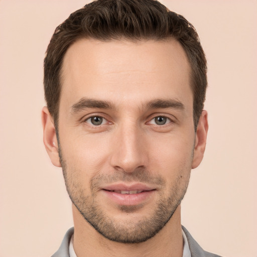 Joyful white young-adult male with short  brown hair and brown eyes